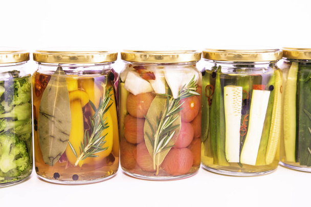Colorful pickles of delicious summer vegetables - Фото, изображение
