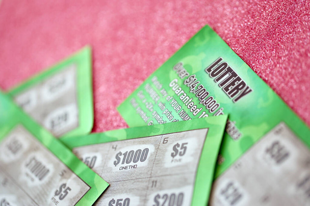 Close up view of green lottery scratch cards. Many used fake instant lottery tickets with gambling results. Gambling addiction concept. - Foto, afbeelding