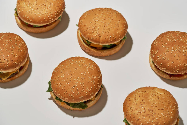 Cropped of rows with set of classic burgers - Fotoğraf, Görsel
