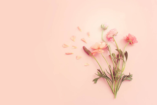 Top view image of pink flowers composition over pastel background - Фото, изображение