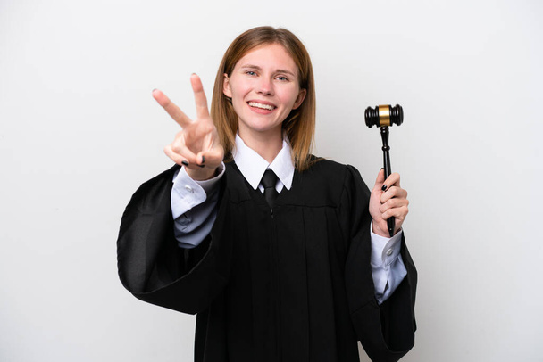 Judge English woman isolated on white background smiling and showing victory sign - Foto, immagini