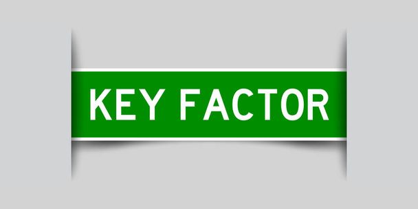 Inserted green color label sticker with word key factor on gray background - Vektori, kuva