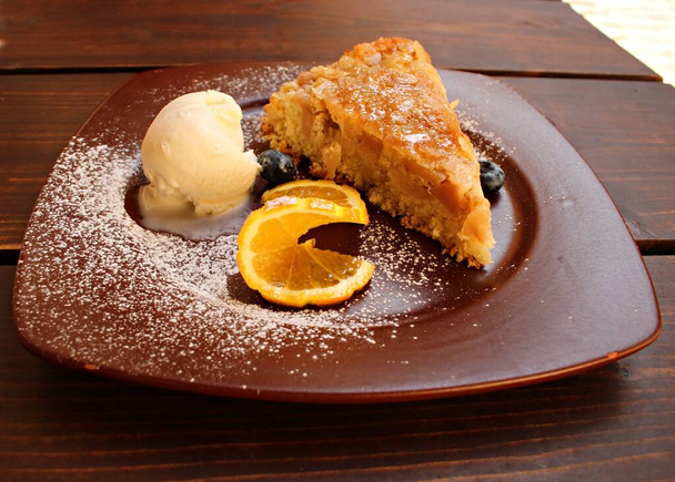 Dessert of apple pie and ice cream ball on a ceramic plate. - Fotografie, Obrázek