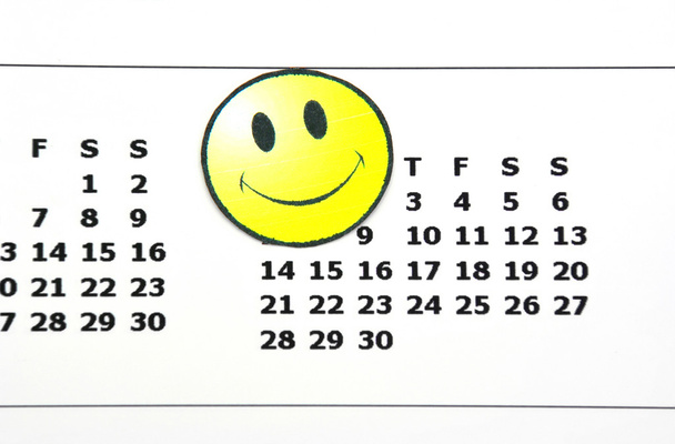 Joyeux visage sur un calendrier
 - Photo, image