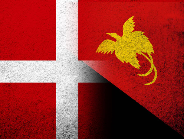 the Kingdom of Denmark National flag with The Independent State of Papua New Guinea National flag. Grunge Background - Photo, Image