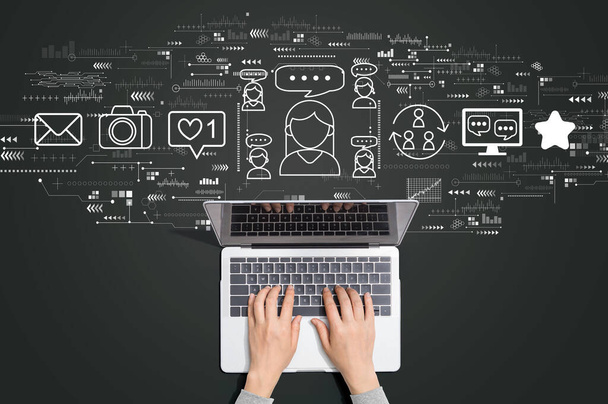 Social media theme with person using laptop - Φωτογραφία, εικόνα