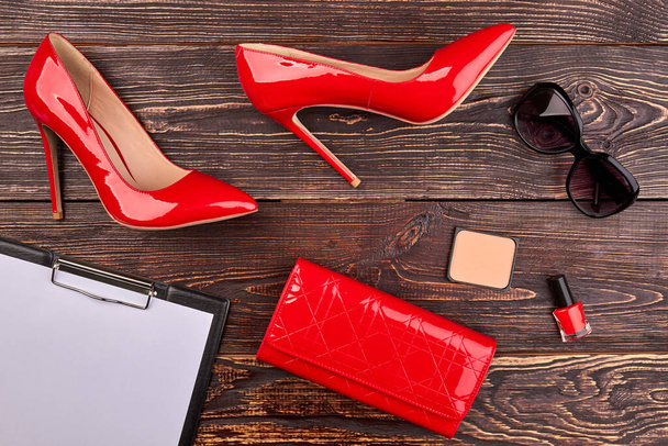 Woman fashion red high heels and accessories. - Photo, image
