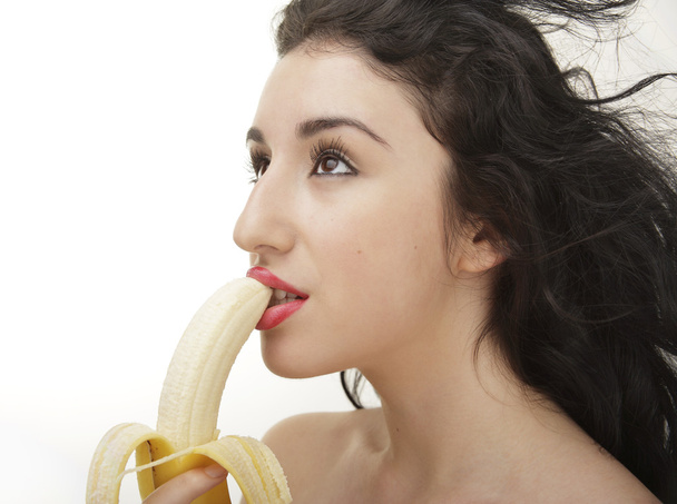 Kaunis seksikäs nainen syö banaania
 - Valokuva, kuva