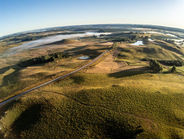 Aerial view of farm fields with fog, Cambara do Sul, Rio Grande do Sul, Brazil - Foto, Imagen