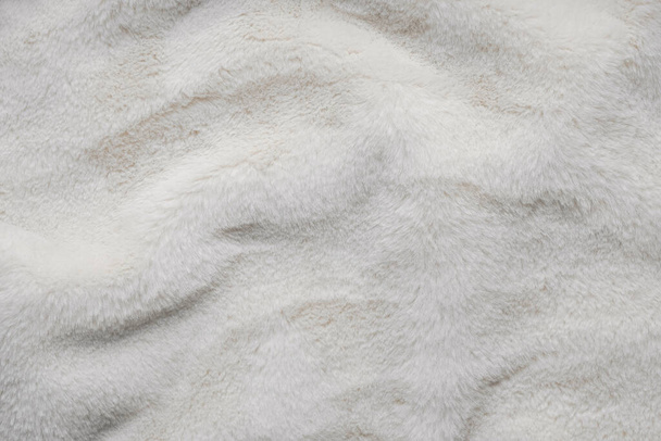 Texture of faux fur. Empty place for text, quote or sayings. Top view. Closeup. Light fur background. - Φωτογραφία, εικόνα