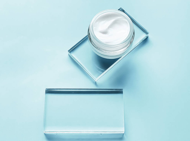 Face cream moisturiser jar on glass and mint background, beauty product and skincare, cosmetic science concept - Photo, Image