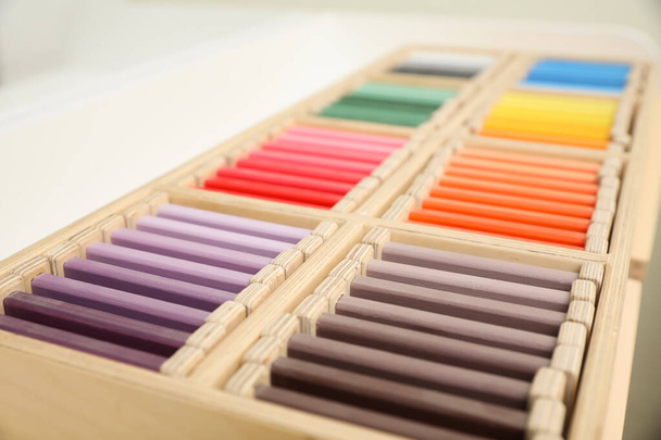 Wooden box with color tablets, closeup. Montessori toy - Photo, Image