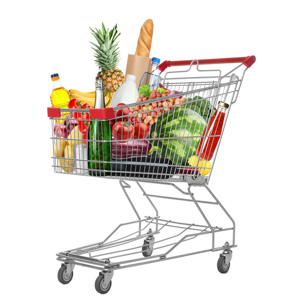 Shopping cart with groceries on white background - Fotó, kép