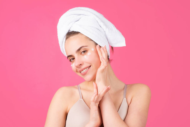Beautiful young woman with clean skin. Girl beauty face care. Facial treatment. Spa skin care, smiling woman wearing hair towel after beauty treatment. Beautiful perfect skin, isolated background. - Fotoğraf, Görsel