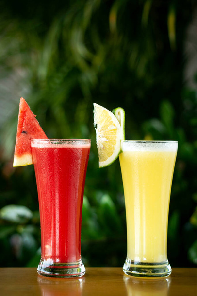 organic mixed fresh fruit juice glasses on cafe table by day - Photo, Image