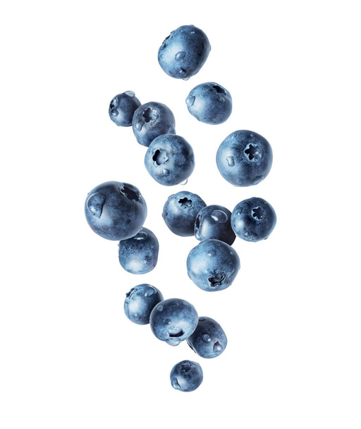 Blueberries with dew drops in the air on a white background - Foto, imagen
