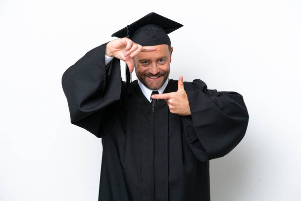 Middle age university graduate man isolated on white background focusing face. Framing symbol - Photo, Image