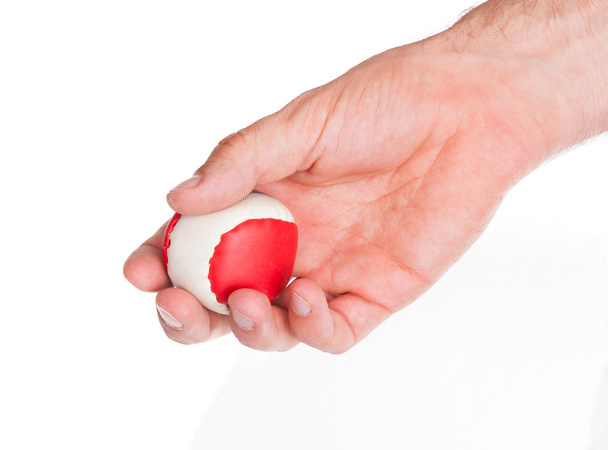 Male hand with a red and white ball - Photo, Image