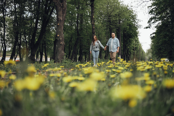 loving couple walking in ukrainian park and city - Photo, Image