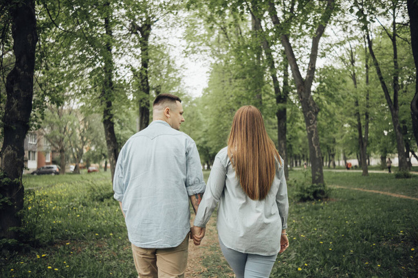 loving couple walking in ukrainian park and city - 写真・画像