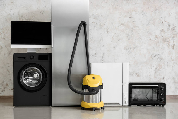 Different household appliances near light wall - Photo, Image