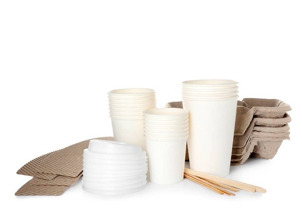 Takeaway paper cups, spoons and holders on white background - Photo, image