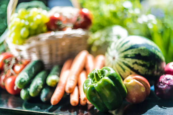 Variety of fresh organic vegetables and fruits in the garden. Balanced diet - Foto, Bild