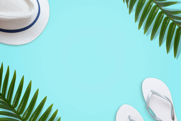 Summer travel flat lay background with hat, slippers and palm leaves - Foto, Imagen