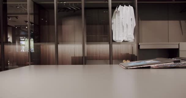 Dressing room with shirts. Elegant Wooden Built Walk In Closet Decoration. - Video, Çekim