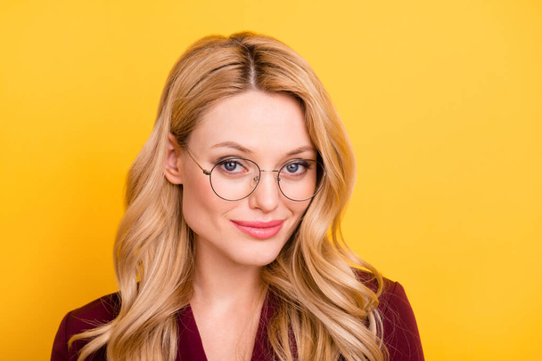 Photo of pretty adorable young lady dressed red clothes spectacles smiling empty space isolated yellow color background - Φωτογραφία, εικόνα