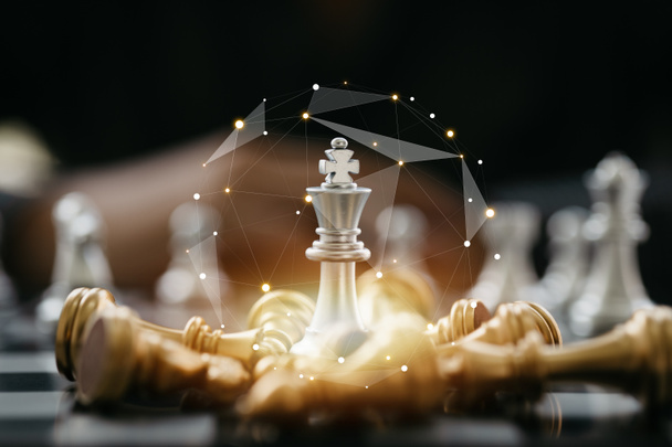 Close-up of a game of chessboard with chess pieces. Chessboard Concept vs. Business Management on Risk, Graphic Charts Showing Financial Flows and Business Performance. Risk management. - Fotoğraf, Görsel
