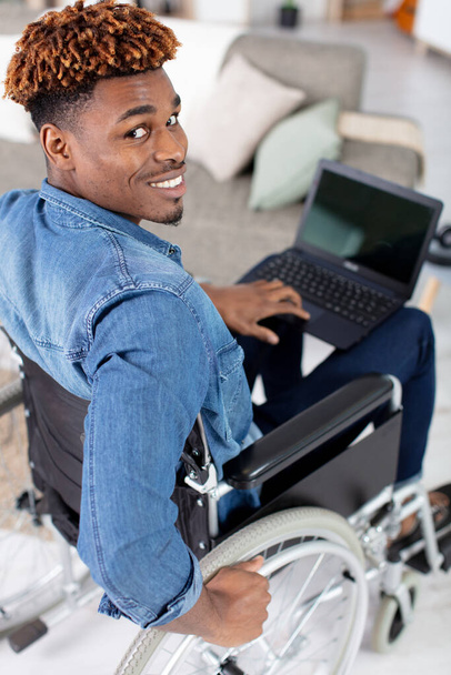 handsome young handicapped man in wheelchair - Φωτογραφία, εικόνα
