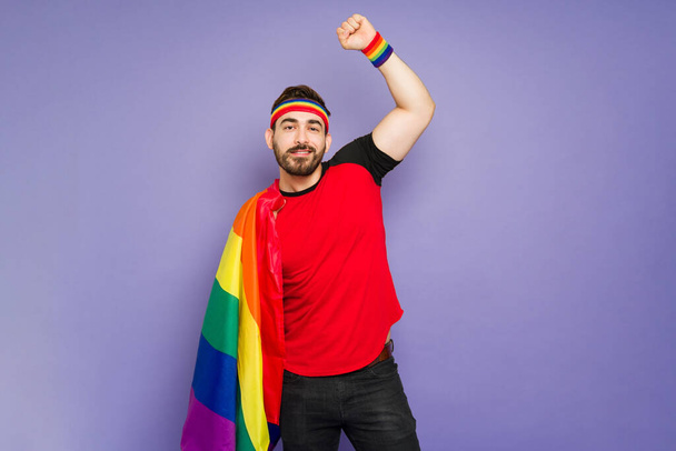 Portrait of a queer man celebrating during pride parade and supporting gay rights - Foto, Imagem
