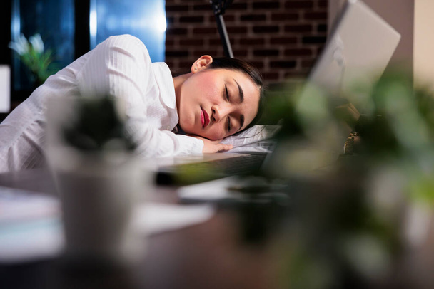 Exhausted financial accountant suffering from sleepiness after overtime working hours. - Photo, Image