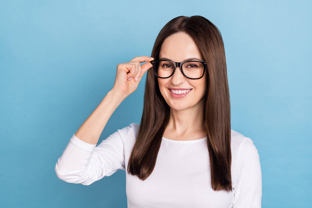 Photo of ceo mature brunette lady wear eyewear white shirt isolated on blue color background - Zdjęcie, obraz