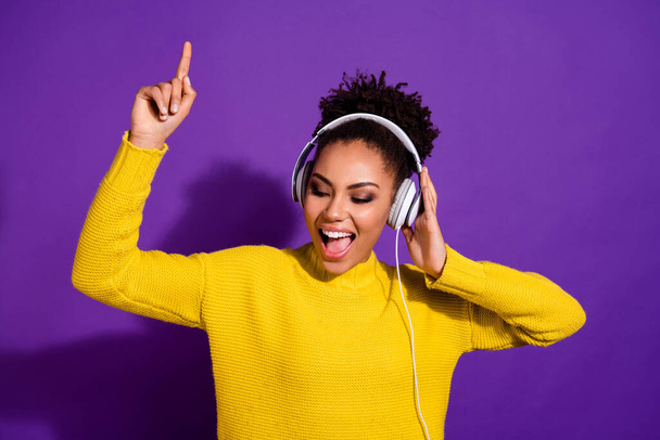Portrait of cheerful excited person enjoy listen favorite song playlist isolated on purple color background - Foto, imagen
