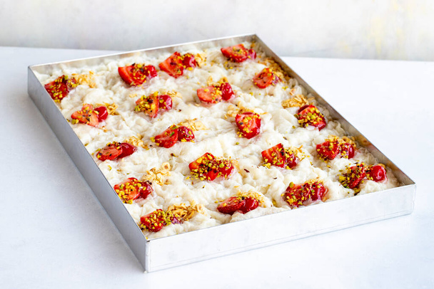 Gullac dessert on a white background. Sliced Gullac dessert in tray - Foto, immagini