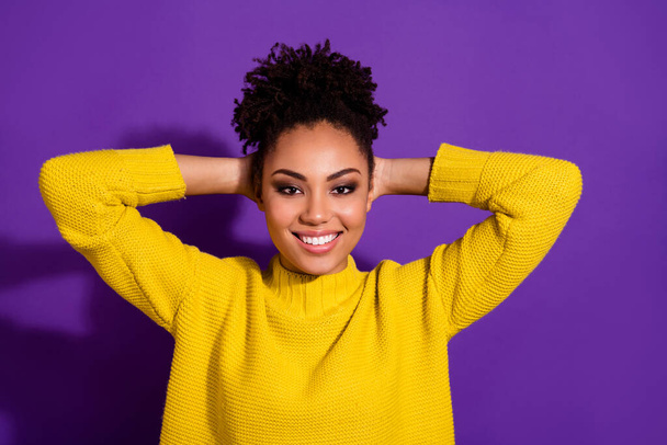 Portrait of cheerful nice person arms behind head toothy smile look camera isolated on purple color background - Foto, immagini