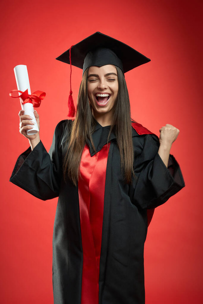 Glad, happy girl graduating from college, university, high school. - Фото, зображення