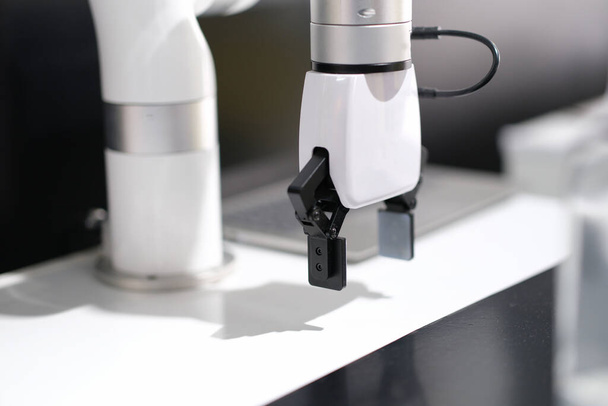 Mechanical white arm robotic arm in production - Foto, Imagem