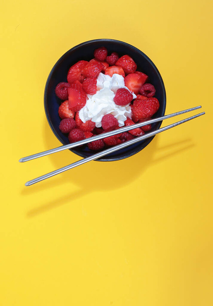 red fruit salad in a cut with chopsticks - Φωτογραφία, εικόνα