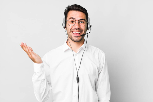young adult hispanic man feeling happy, surprised realizing a solution or idea. telemarketer concept - Φωτογραφία, εικόνα