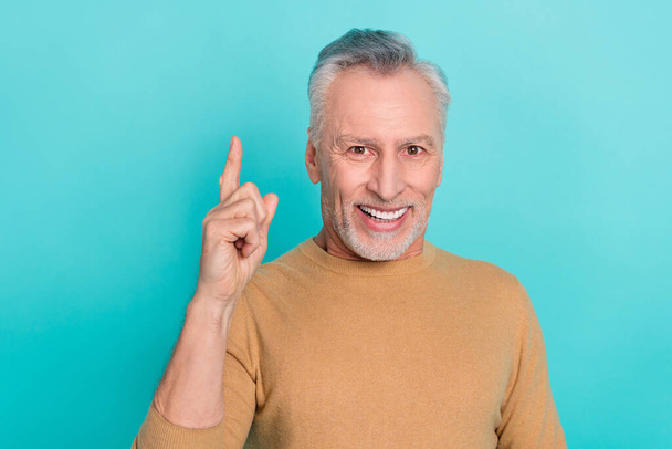 Photo of candid cheerful creative man point finger excellent choice isolated on teal color background - Foto, afbeelding