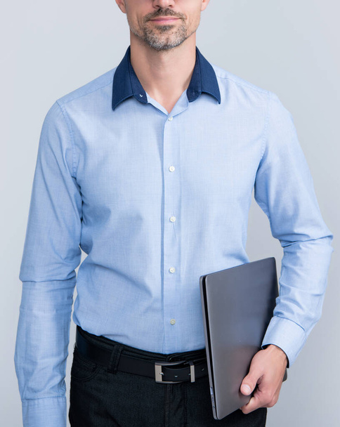 mature man in glasses hold pc on grey background - Fotografie, Obrázek