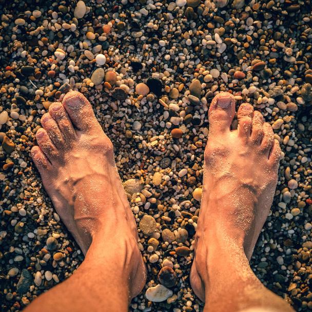 Barefoot fellign the sand at the beach - Zdjęcie, obraz