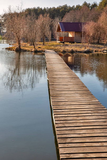 Landscape with small wooden fishing house on Virlya lake in the forest. Velyki Berezhtsi, Kremenets, Ternopil region, Ukraine. - Photo, Image