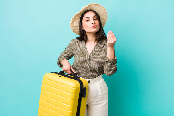 young pretty woman making capice or money gesture, telling you to pay. travel concept - Photo, Image