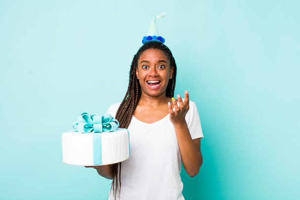 young adult black woman looking desperate, frustrated and stressed. birthday concept - Foto, afbeelding