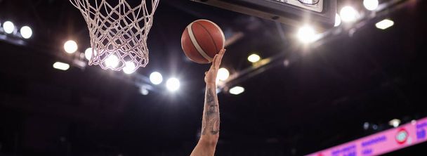 basketball game ball going through hoop - 写真・画像