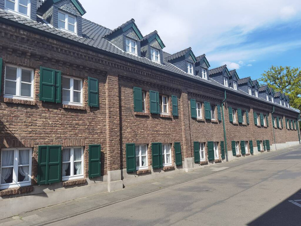 Very nice brick townhouses with green sunshades on the windows - Foto, imagen